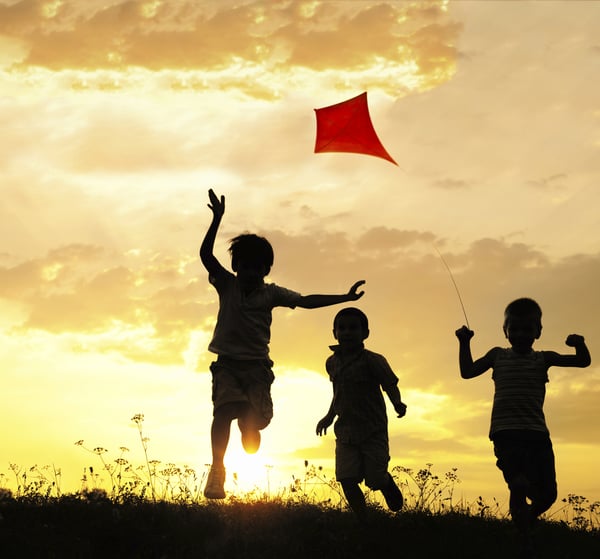 Children running with kite