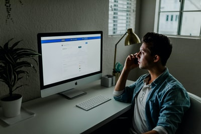 man considering google keywords 