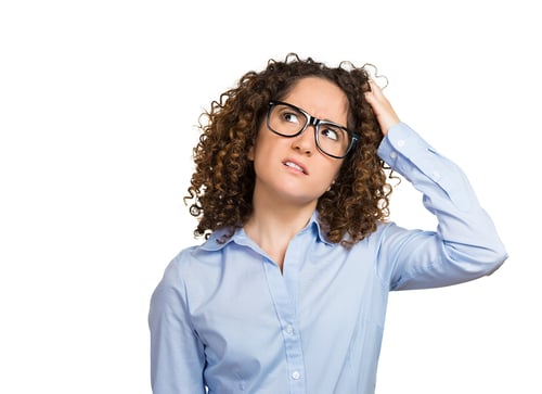 Closeup portrait young woman with glasses scratching head, thinking daydreaming deeply about something, looking up, isolated white background. Human facial expression emotions, feelings, body language