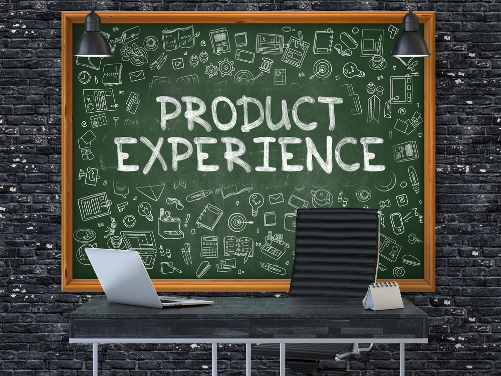 Green Chalkboard with the Text Product Experience Hangs on the Dark Brick Wall in the Interior of a Modern Office. Illustration with Doodle Style Elements. 3D.