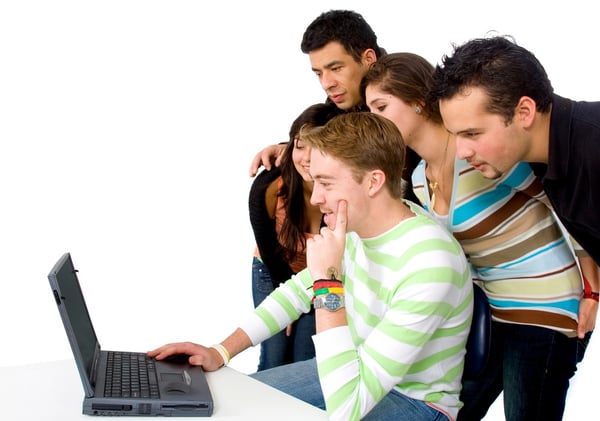 group of people on a laptop over a white background